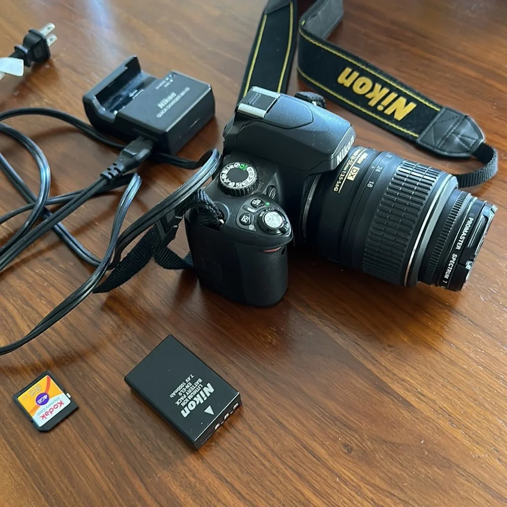 Nikon D60 digital camera with 4GB memory card, lens, battery, & charger included